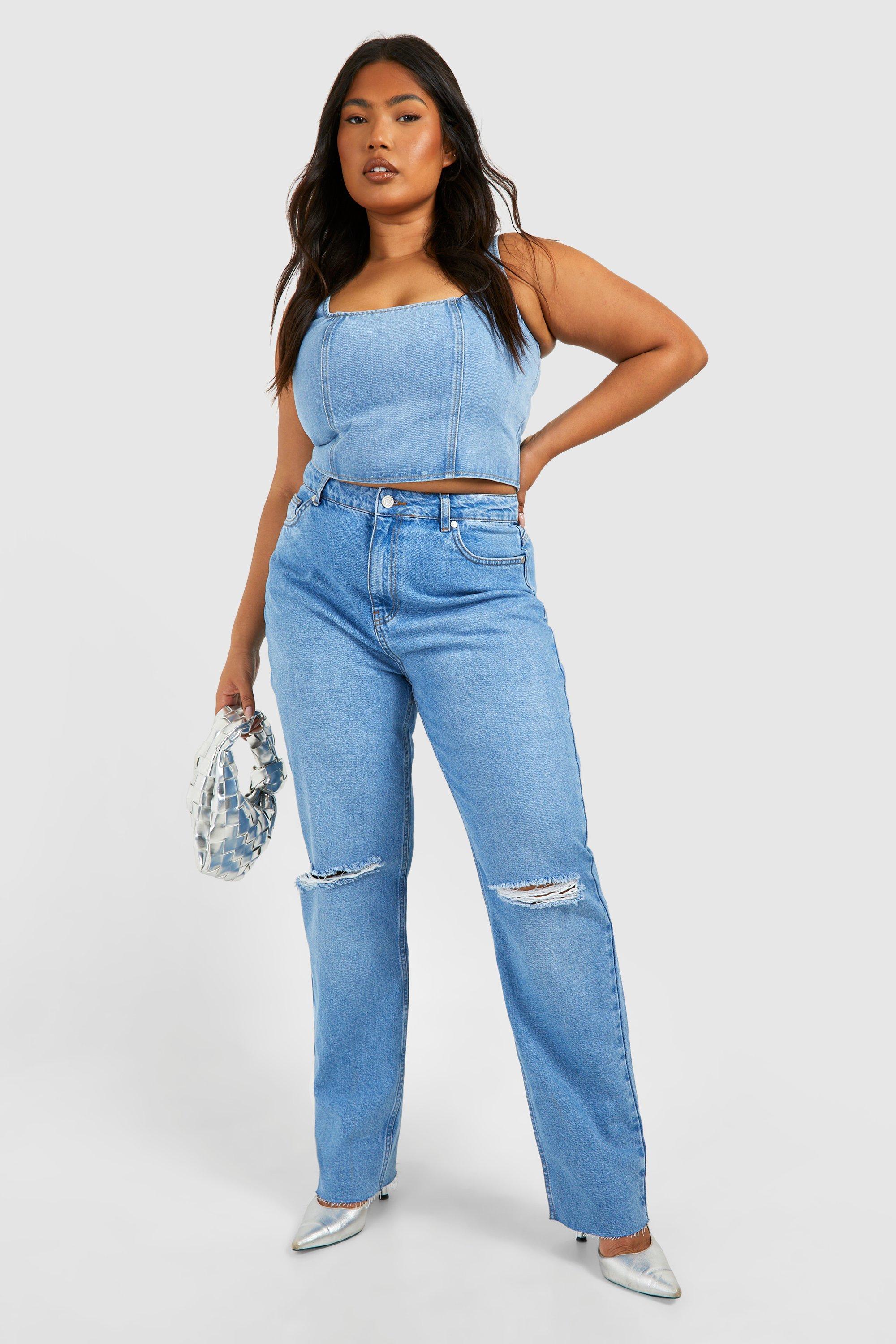 Mid wash store ripped mom jeans